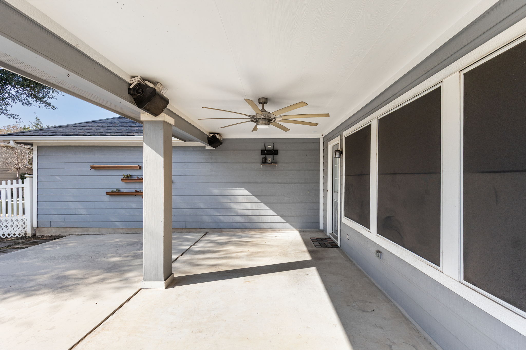 784 Sampson Kyle, TX 78640 - Photo 31 of 40 A spacious covered patio provides a shaded outdoor retreat adjacent to the home.