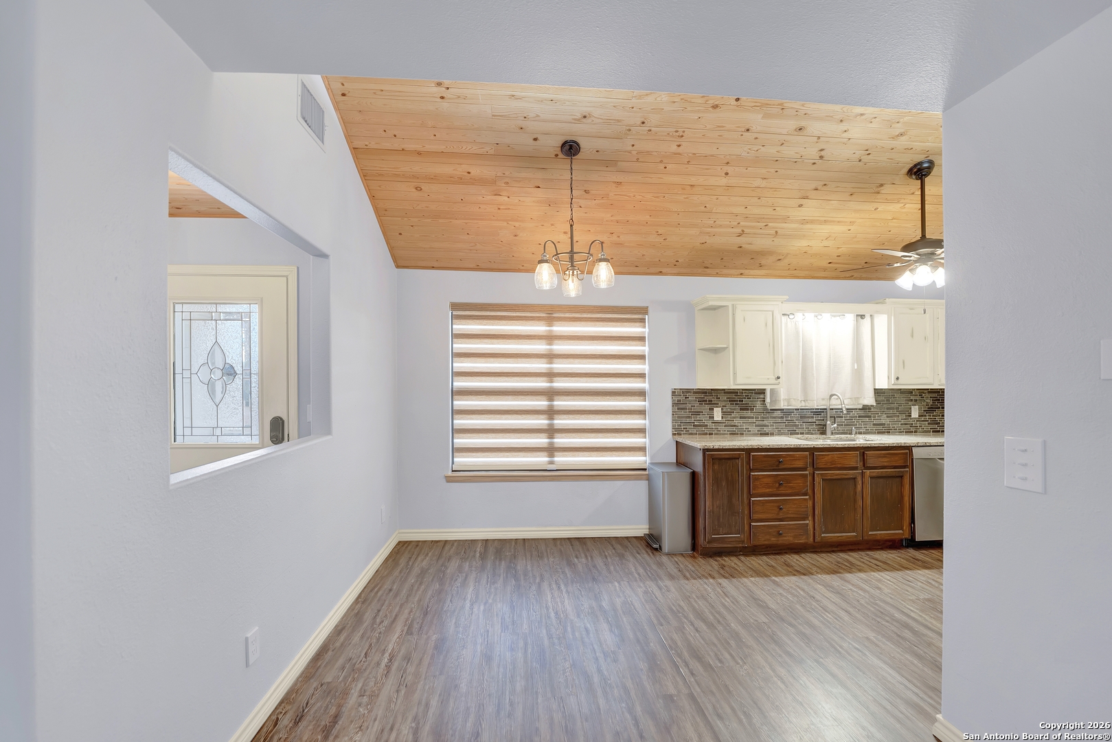568 Firewheel Drive Bandera, TX 78003 - Photo 20 of 45 a view of kitchen and kitchen with granite countertop a stove top oven