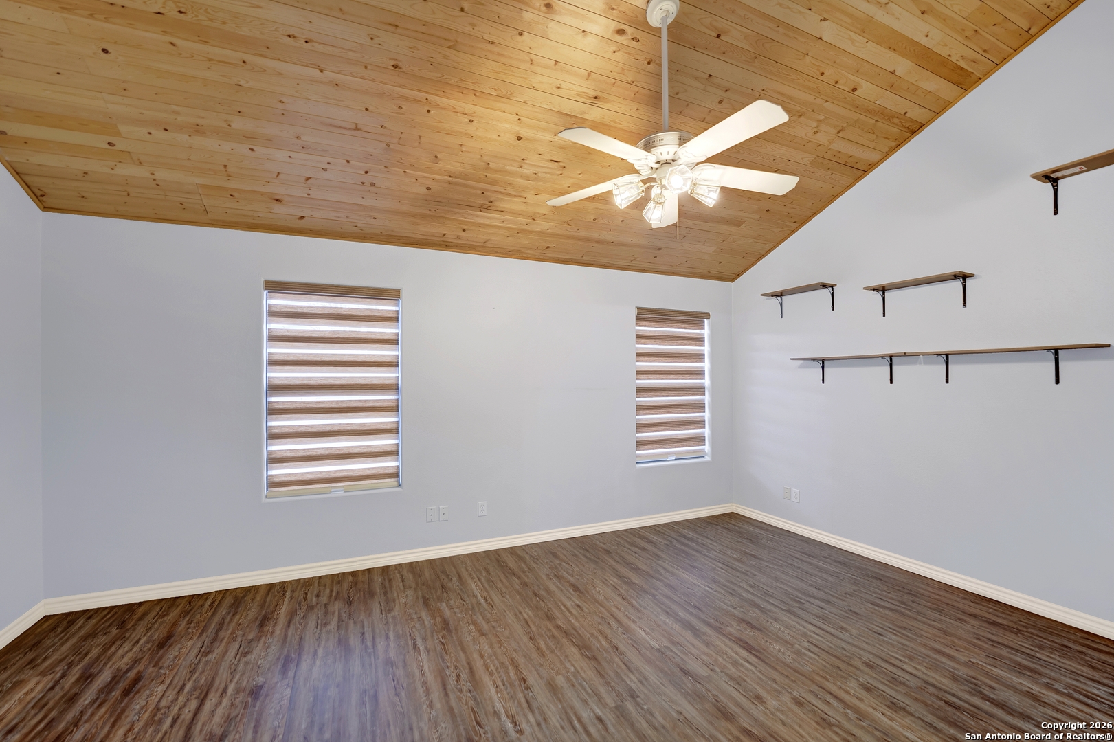 568 Firewheel Drive Bandera, TX 78003 - Photo 22 of 45 a view of empty room with wooden floor and fan