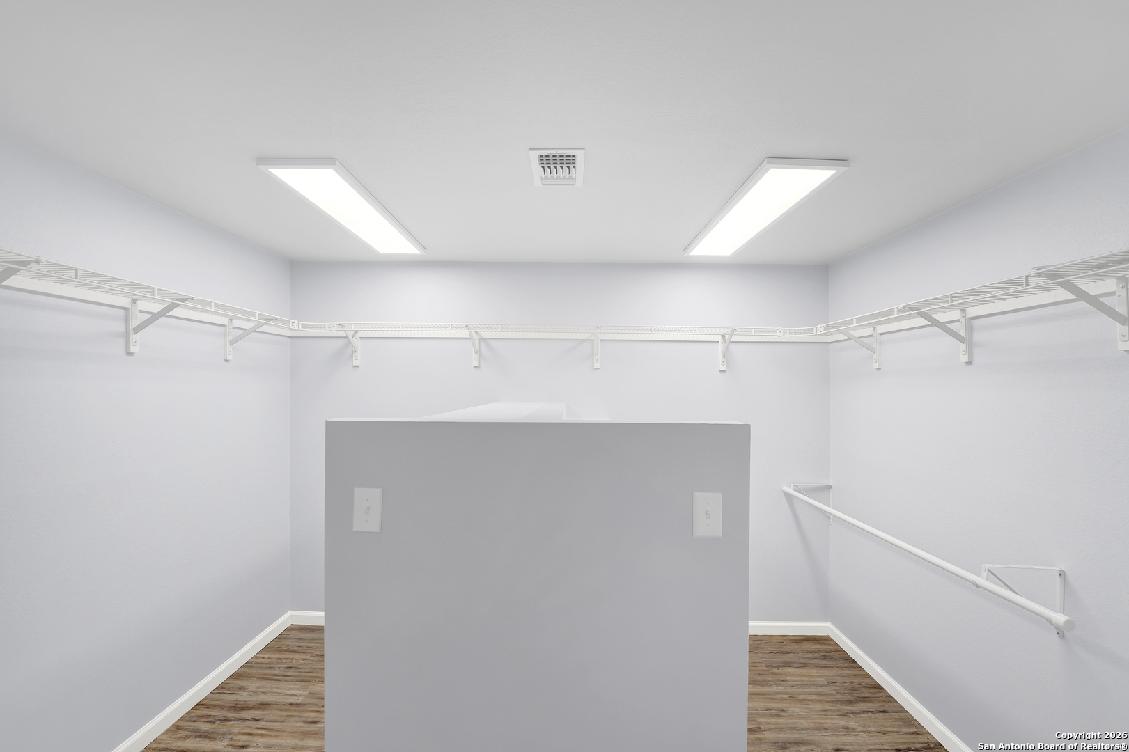 568 Firewheel Drive Bandera, TX 78003 - Photo 24 of 45 a view of walk in closet with empty racks