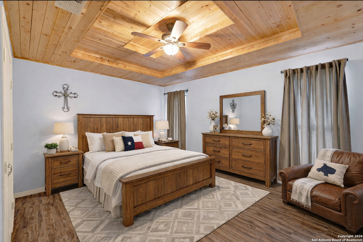 568 Firewheel Drive Bandera, TX 78003 - Photo 27 of 45 a bedroom with a bed and a dresser