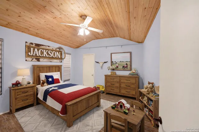 a bedroom with a bed and furniture