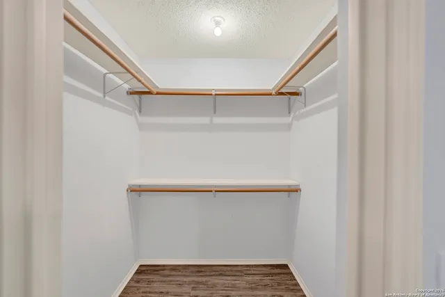 a view of an empty walk in closet