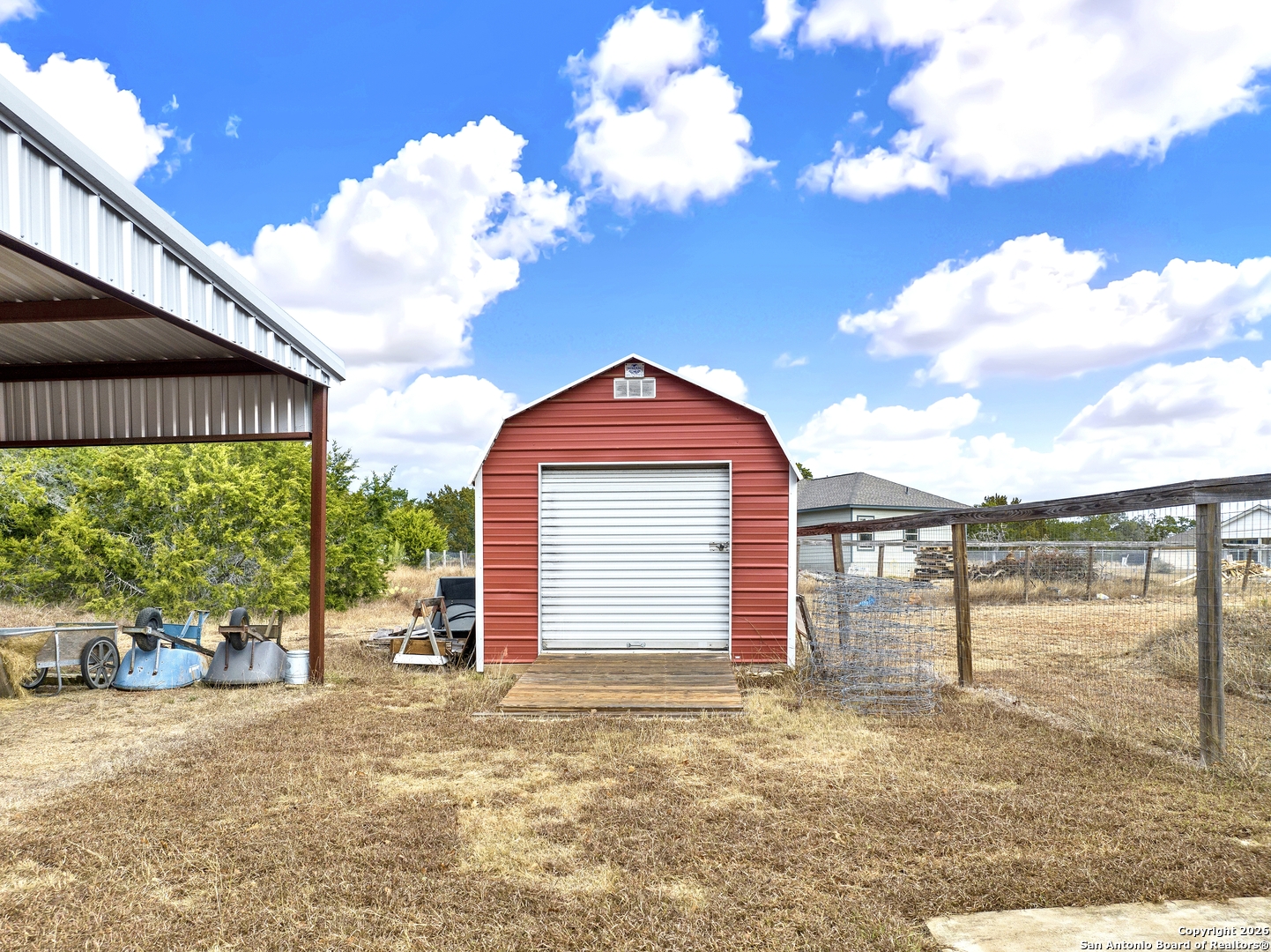 568 Firewheel Drive Bandera, TX 78003 - Photo 40 of 45 a view of a house with backyard and a garden