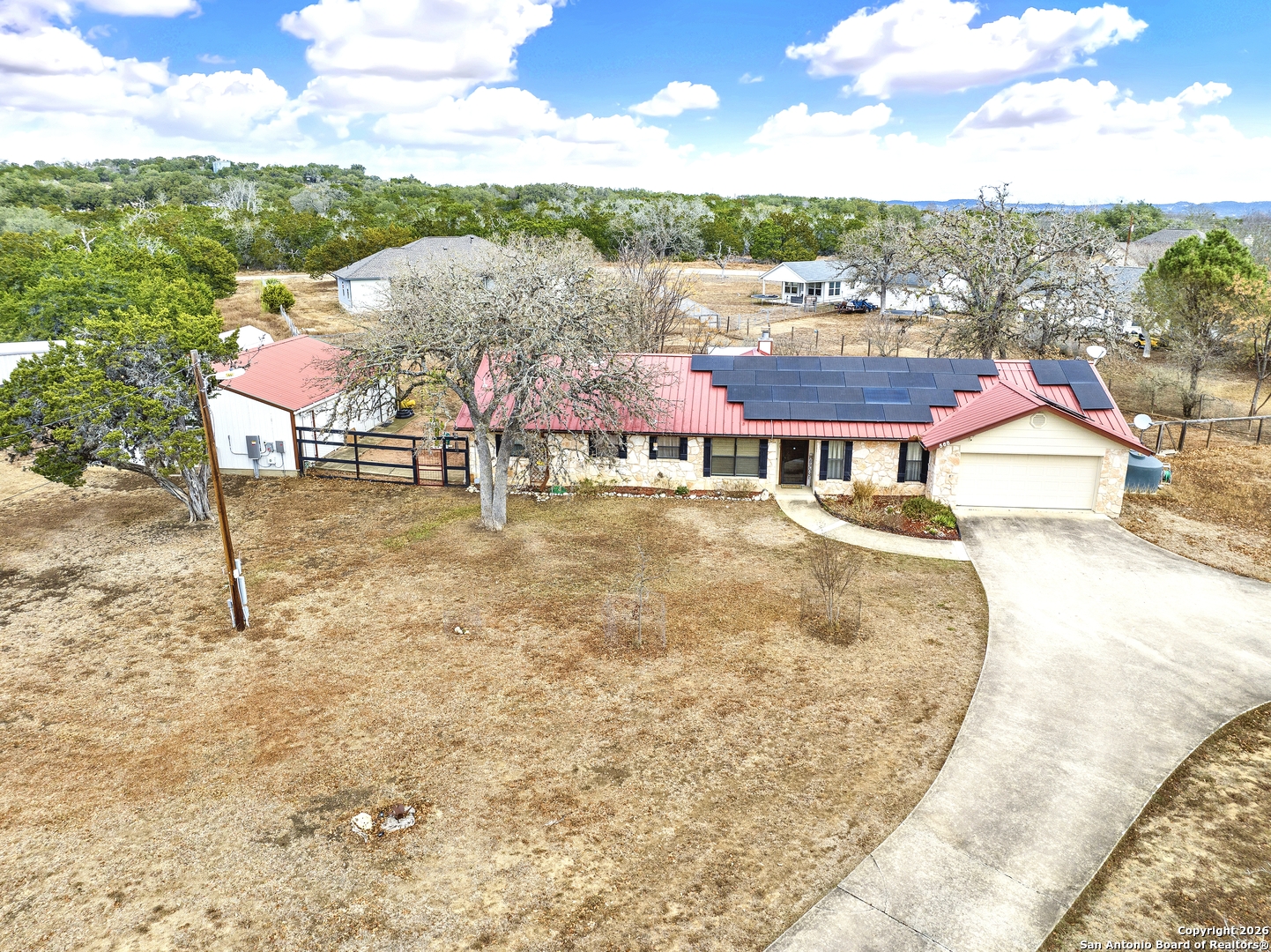 568 Firewheel Drive Bandera, TX 78003 - Photo 4 of 45 a view of houses with swimming pool