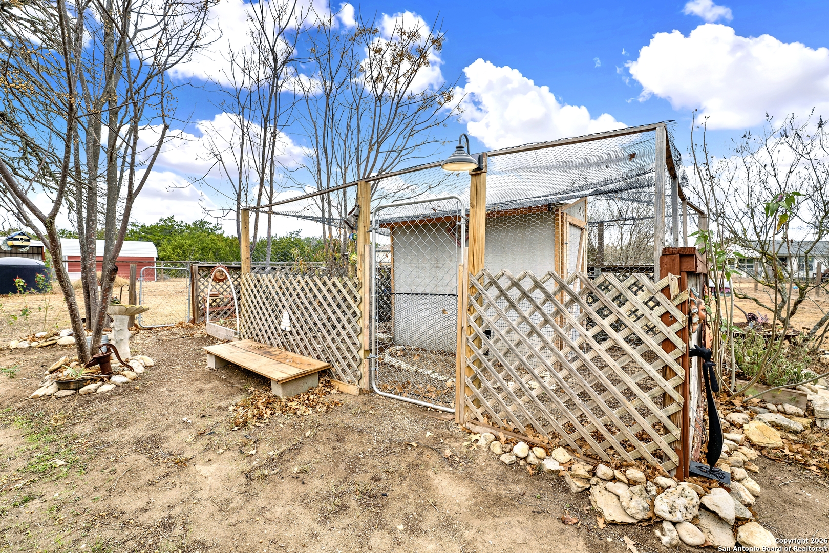 568 Firewheel Drive Bandera, TX 78003 - Photo 45 of 45 front view of a house with a large tree