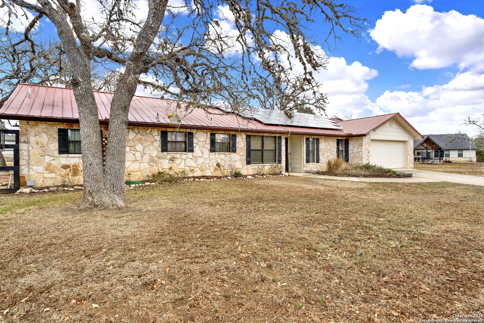 568 Firewheel Drive Bandera, TX 78003 - Photo 5 of 45 a front view of a house with a yard