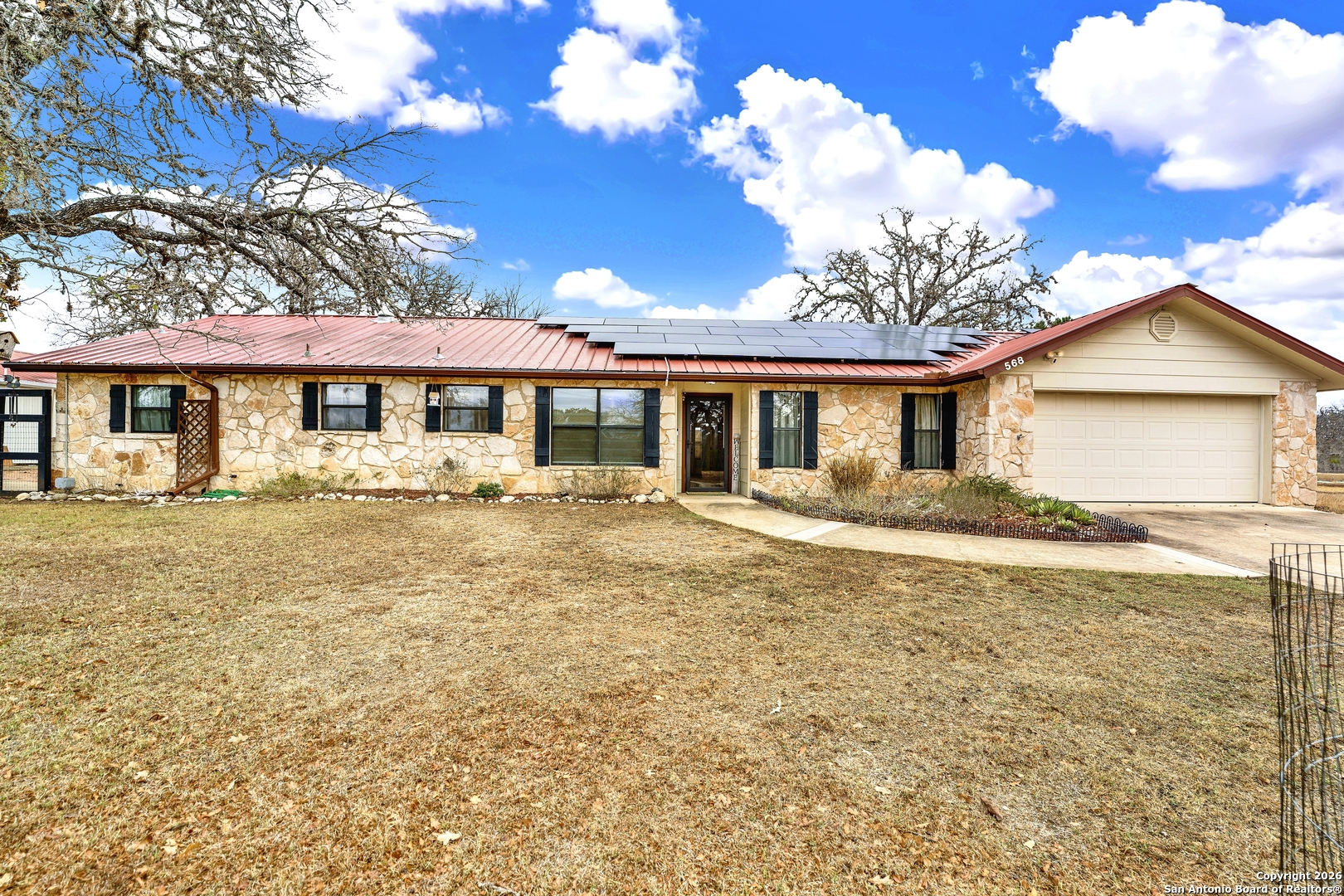 568 Firewheel Drive Bandera, TX 78003 - Photo 6 of 45 a front view of a house with garden
