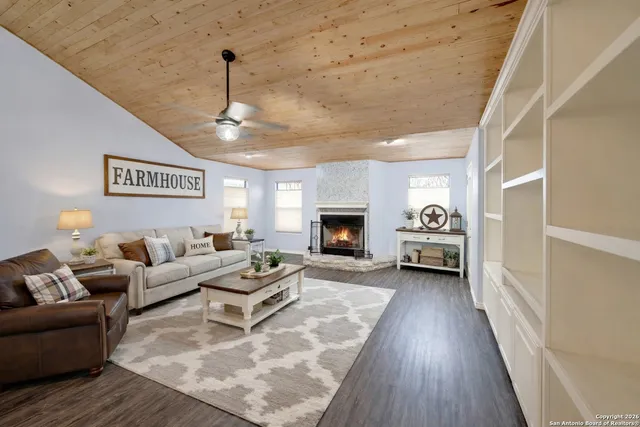 a living room with furniture and a fireplace