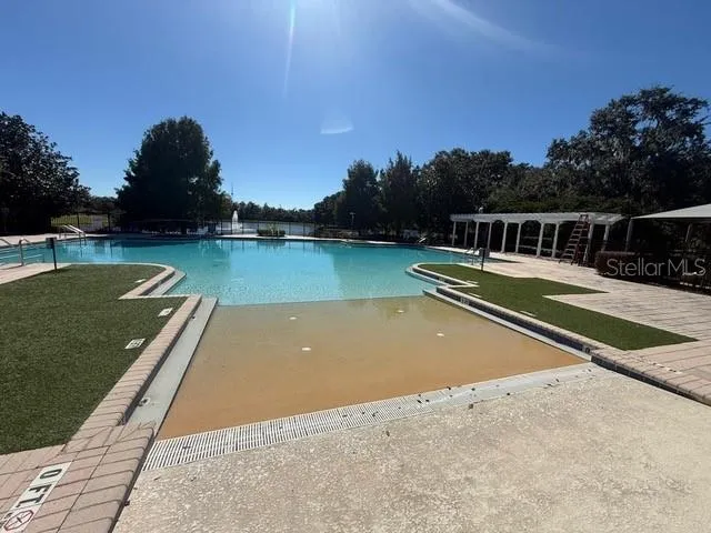 a view of a swimming pool with a lake view