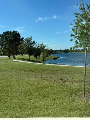 a view of a golf course with a lake