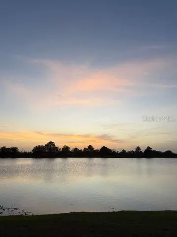a view of lake from sunset