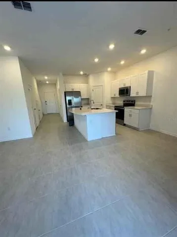 a kitchen with a sink and counter top space