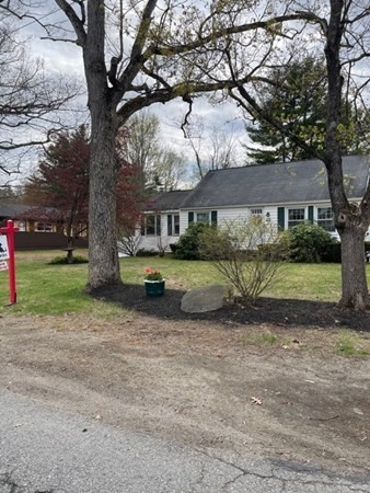 45 Harvard Road Shirley, MA 01464 - Photo 1 of 37 a view of a yard with a house and large trees