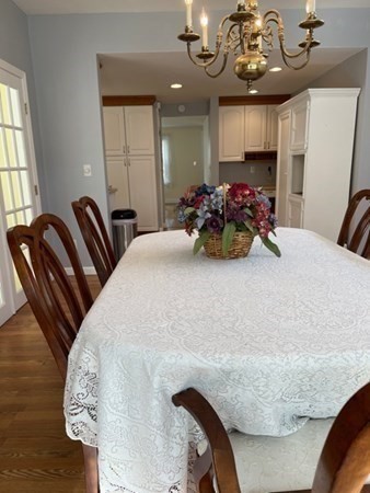 45 Harvard Road Shirley, MA 01464 - Photo 13 of 37 a bedroom with a bed and chandelier