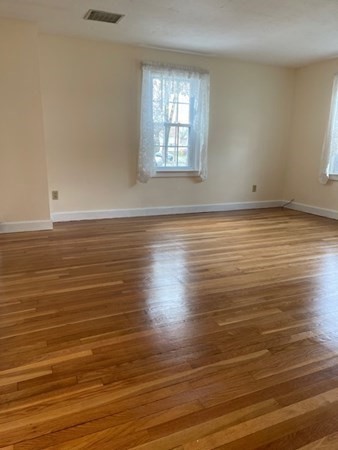 45 Harvard Road Shirley, MA 01464 - Photo 18 of 37 an empty room with wooden floor and windows