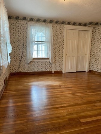 45 Harvard Road Shirley, MA 01464 - Photo 20 of 37 an empty room with wooden floor and windows