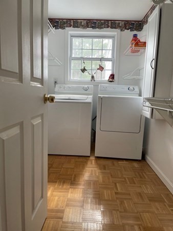 45 Harvard Road Shirley, MA 01464 - Photo 24 of 37 a room with a washing machine and mirrors