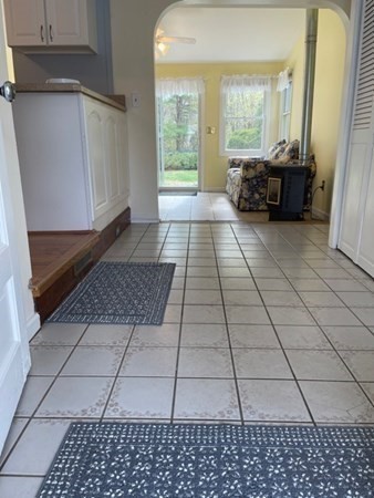 45 Harvard Road Shirley, MA 01464 - Photo 5 of 37 a living room with a black white checkered floor