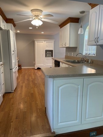 45 Harvard Road Shirley, MA 01464 - Photo 6 of 37 a kitchen with a sink appliances and cabinets