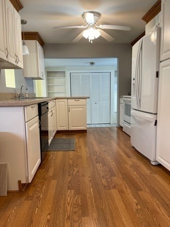 45 Harvard Road Shirley, MA 01464 - Photo 7 of 37 a kitchen with granite countertop a stove a sink and a refrigerator