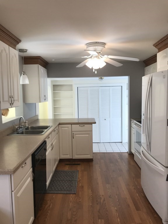 45 Harvard Road Shirley, MA 01464 - Photo 10 of 37 a kitchen with a refrigerator a sink and dishwasher