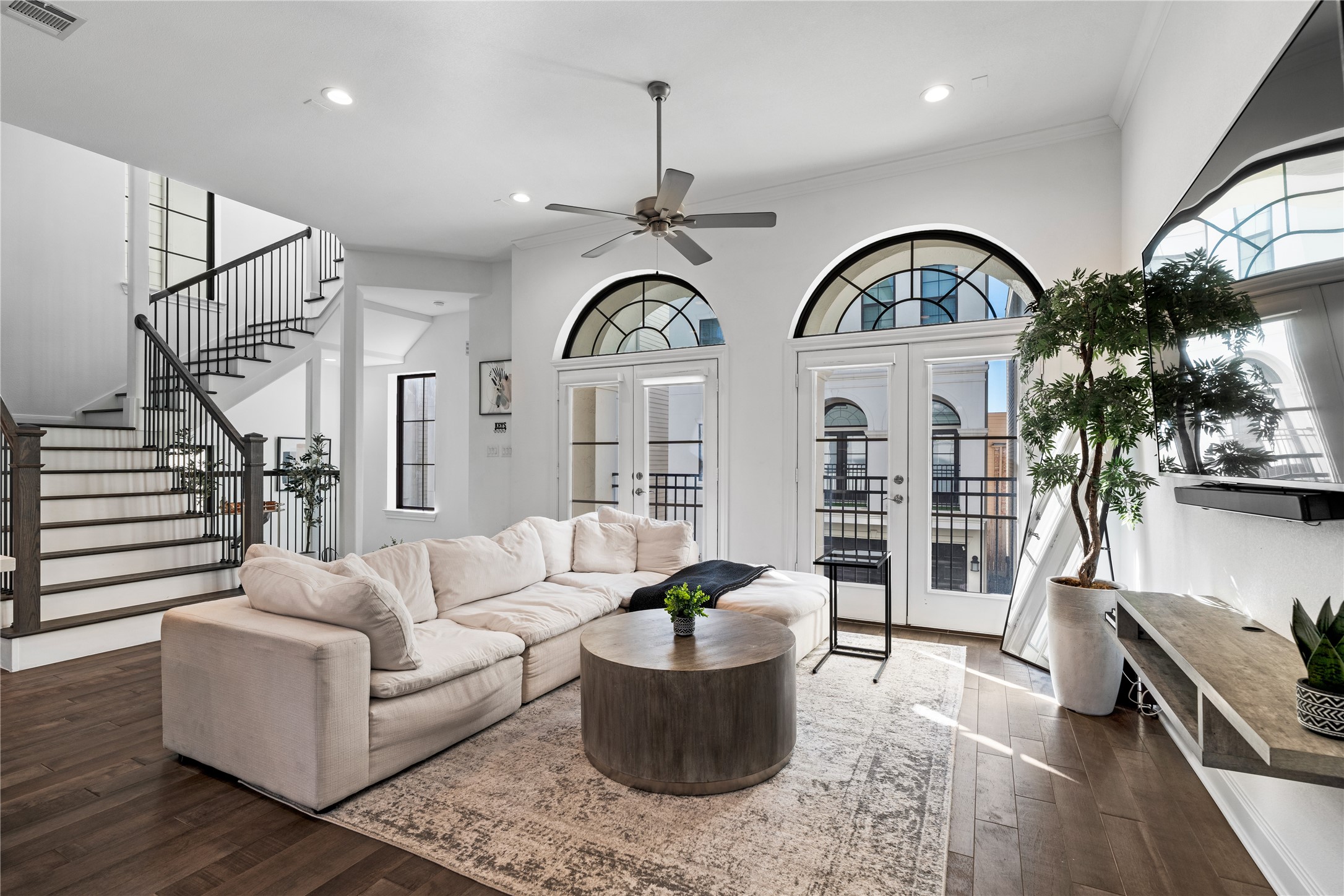 3319 Beverly Forest Drive Houston, TX 77057 - Photo 11 of 32 a living room with furniture a chandelier a rug and a window