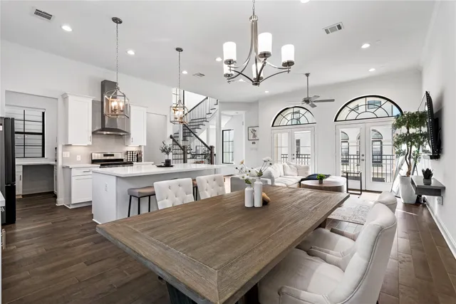 a large kitchen with a table and chairs