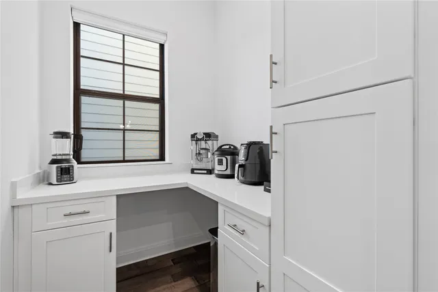 a kitchen with a sink and cabinets