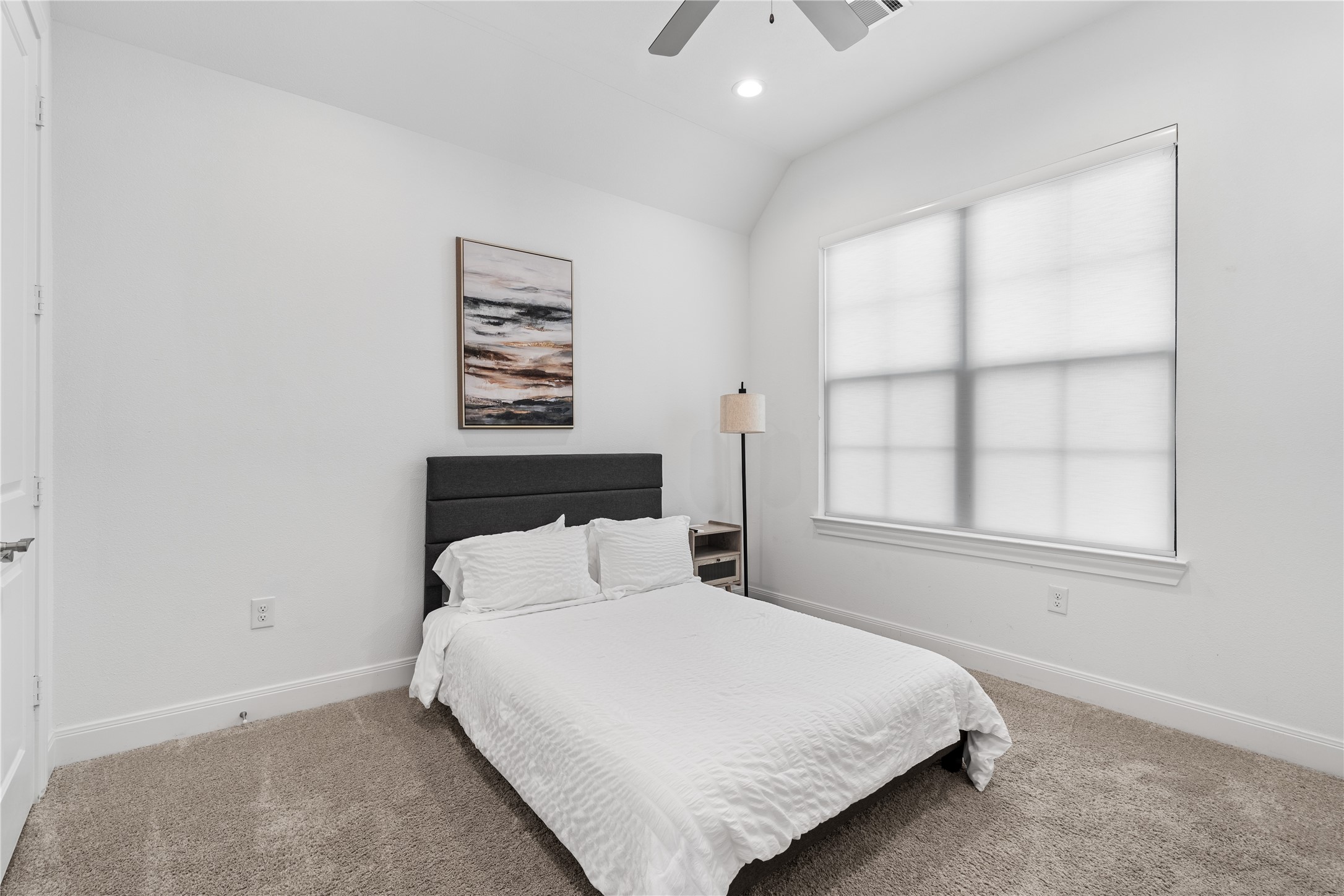 3319 Beverly Forest Drive Houston, TX 77057 - Photo 25 of 32 a bedroom with a bed and a window