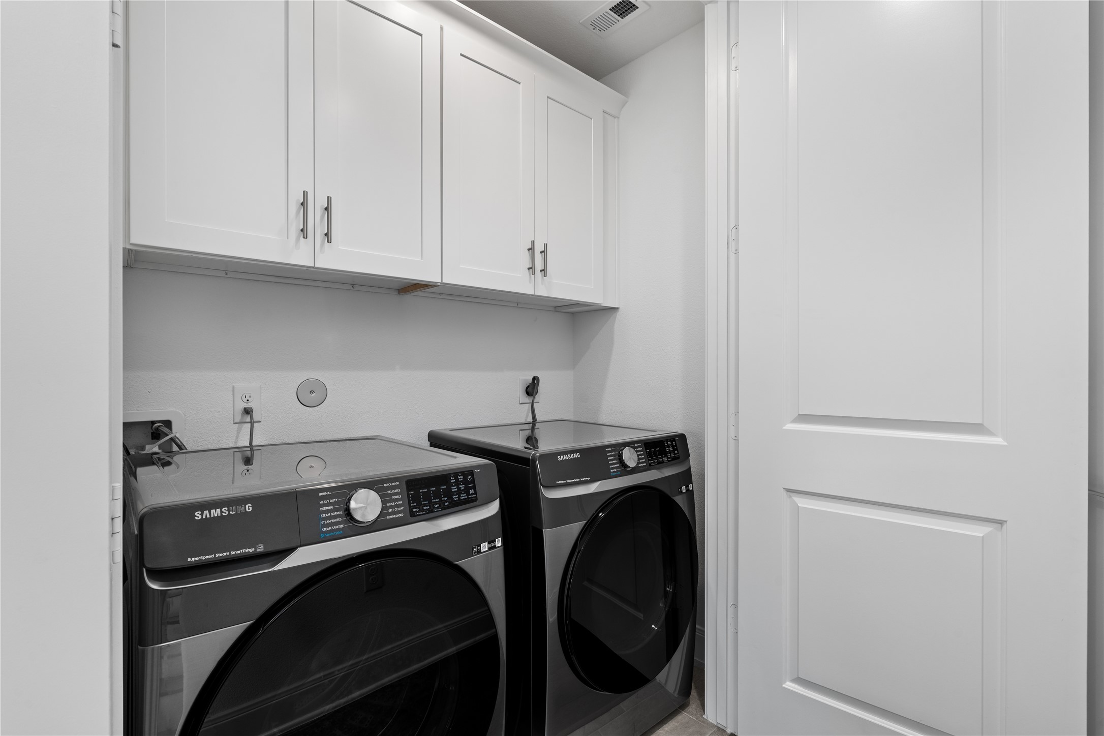 3319 Beverly Forest Drive Houston, TX 77057 - Photo 27 of 32 a view of a storage and utility room with washer and dryer