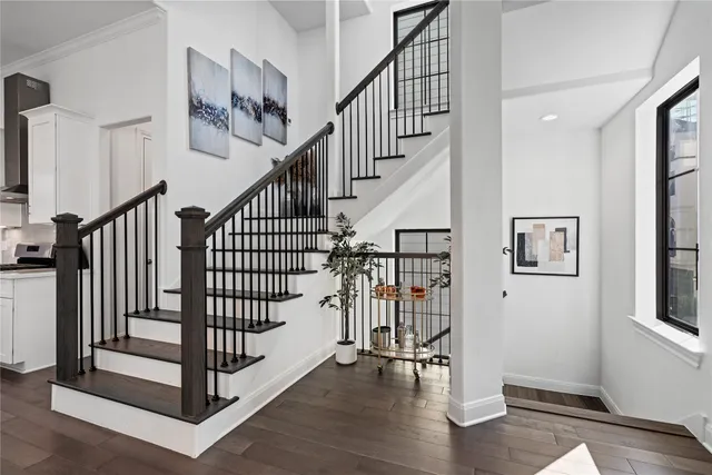 a view of entryway with stairs and wooden floor