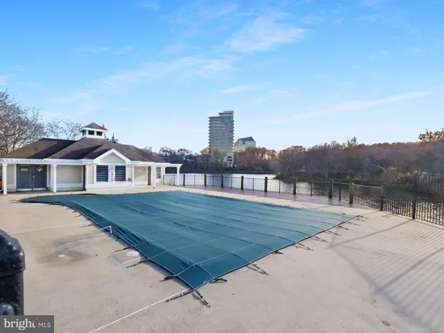 a view of a lake with houses in the back
