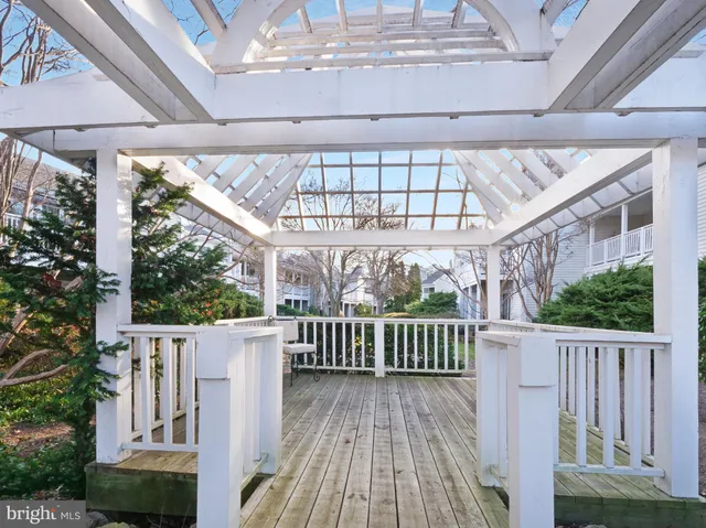 a view of a swimming pool with lawn chairs