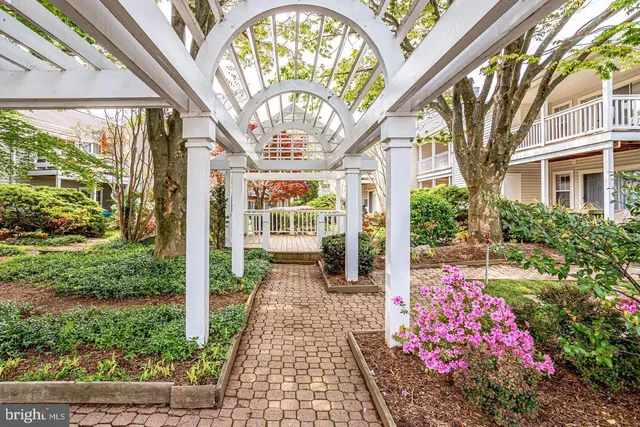 a view of a porch with furniture and a table and chairs