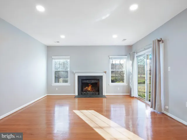 a view of livingroom with furniture window and wooden floor