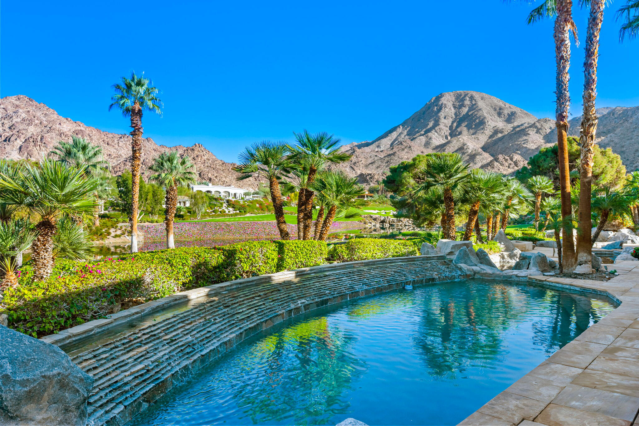 47725 Vintage Drive East Indian Wells, CA 92210 - Photo 1 of 10 a view of a lake with a yard