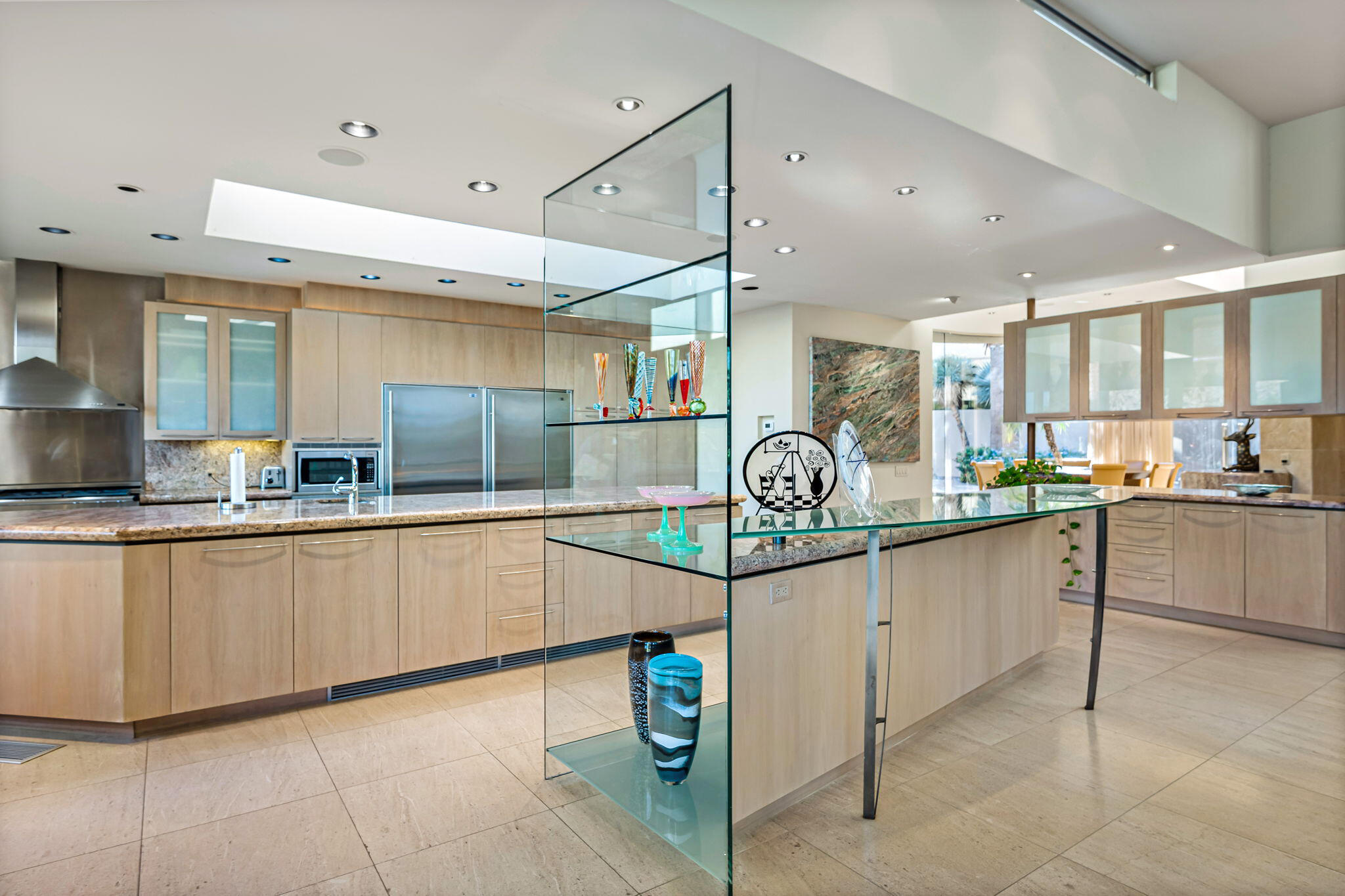 47725 Vintage Drive East Indian Wells, CA 92210 - Photo 4 of 10 a kitchen with stainless steel appliances granite countertop a sink and cabinets