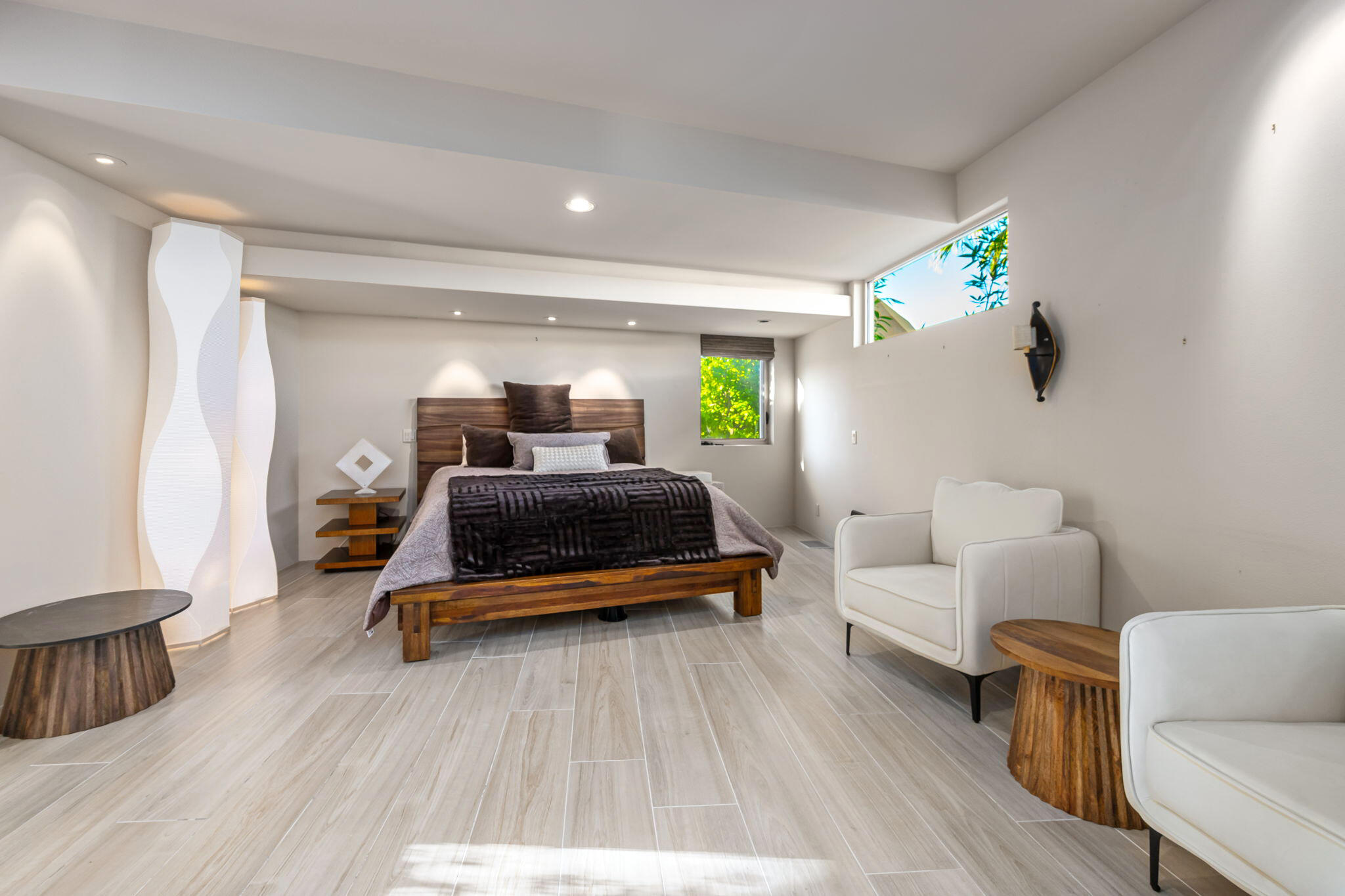 47725 Vintage Drive East Indian Wells, CA 92210 - Photo 7 of 10 a bedroom with furniture and a wooden floor