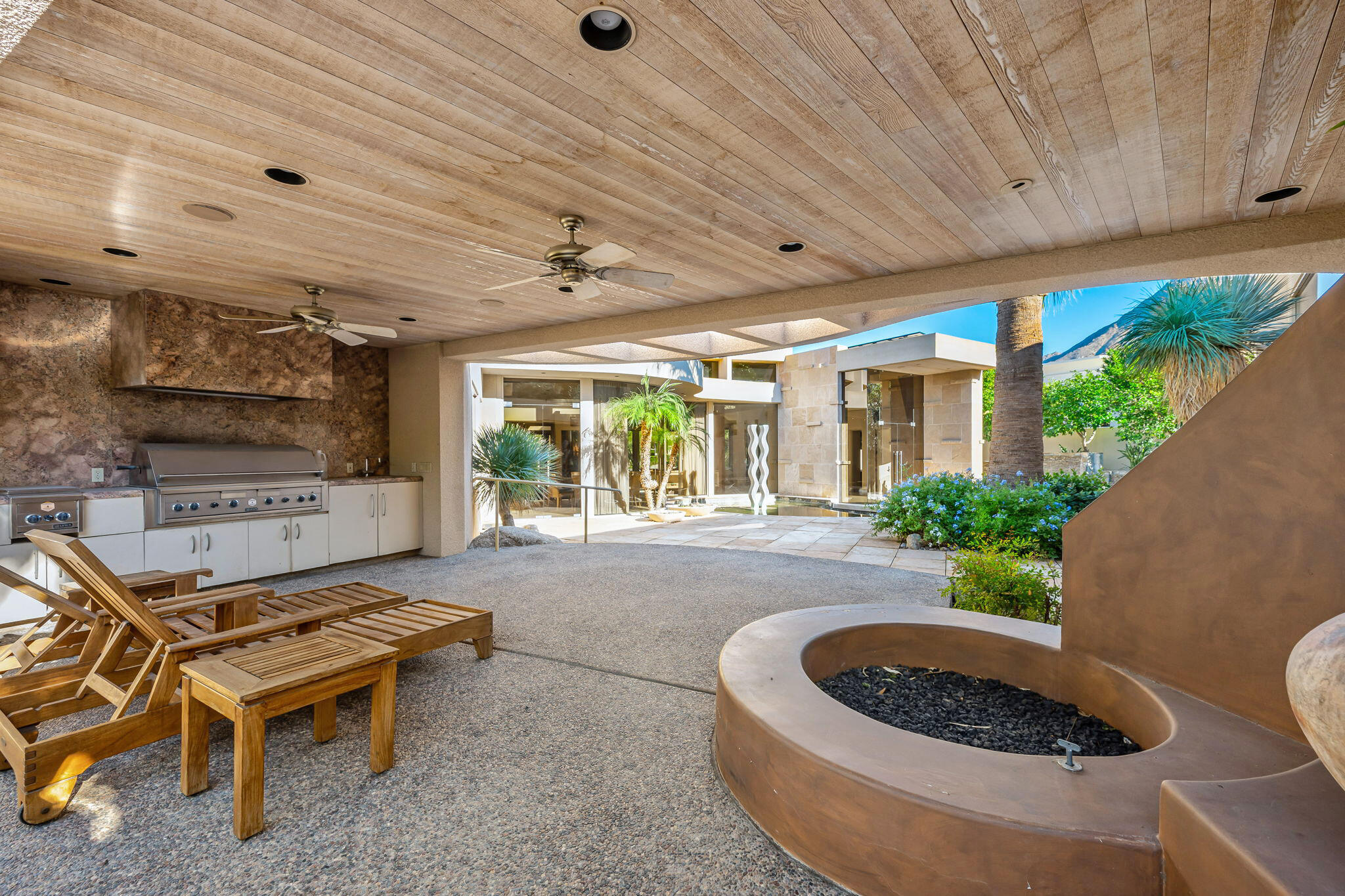 47725 Vintage Drive East Indian Wells, CA 92210 - Photo 8 of 10 a building outdoor space with patio furniture and potted plants