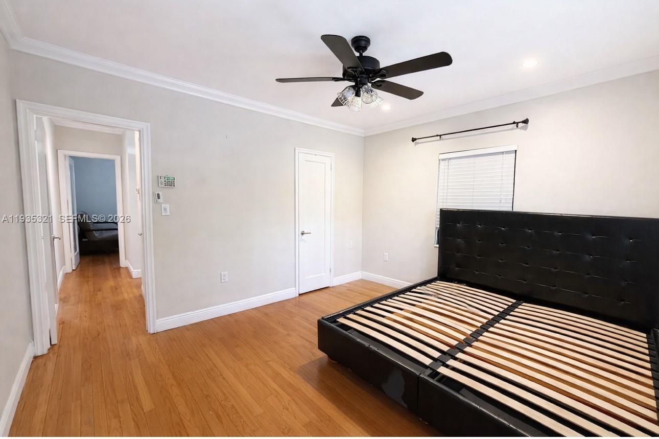 1780 Southwest 21st Street Miami, FL 33145 - Photo 15 of 17 a bedroom with a bed and a dresser