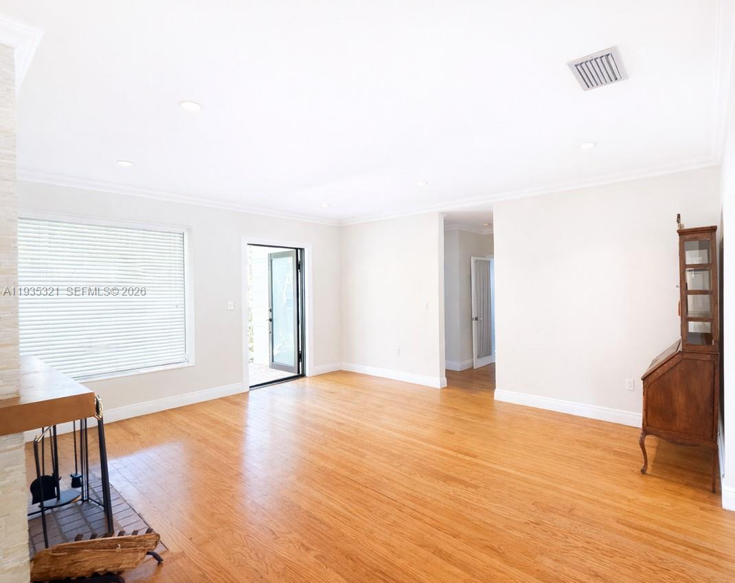 1780 Southwest 21st Street Miami, FL 33145 - Photo 17 of 17 a view of an empty room with wooden floor and a window