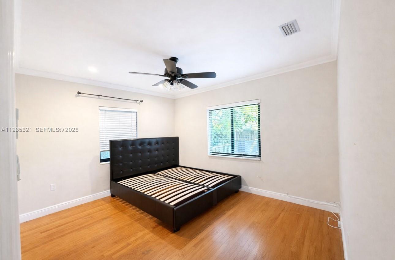 1780 Southwest 21st Street Miami, FL 33145 - Photo 7 of 17 a view of wooden floor and a chandelier in a room