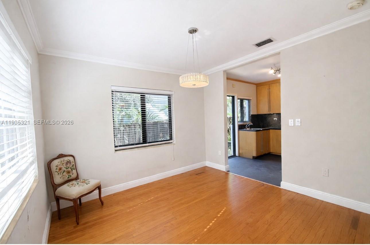 1780 Southwest 21st Street Miami, FL 33145 - Photo 10 of 17 a view of a livingroom with a furniture wooden floor and a window