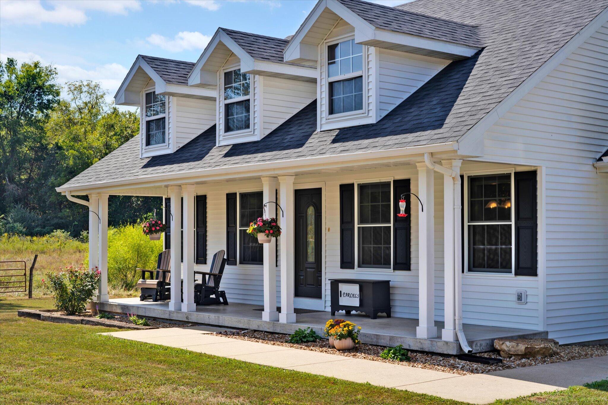 3989 South 70th Road Dunnegan, MO 65640 - Photo 2 of 53 A front porch made for porch sitting