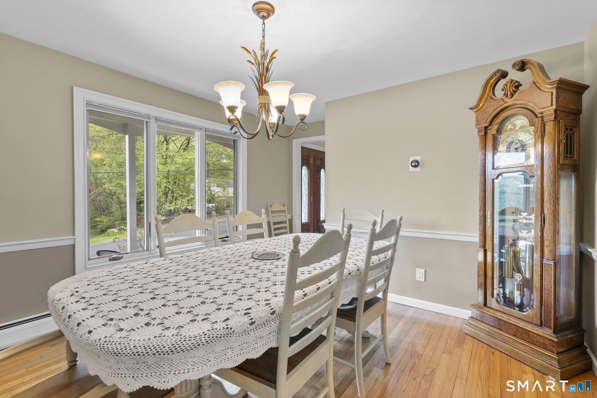 832 Quarter Mile Road Orange, CT 06477 - Photo 14 of 39 a view of a dining room with furniture window and outside view