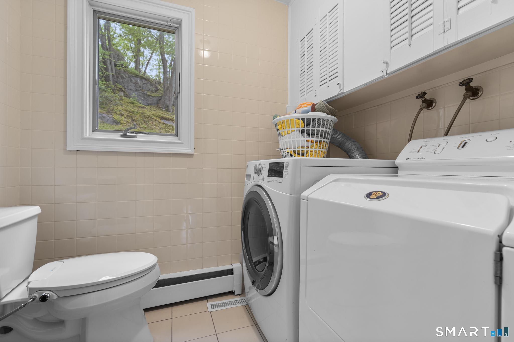 832 Quarter Mile Road Orange, CT 06477 - Photo 29 of 39 a utility room with dryer and washer