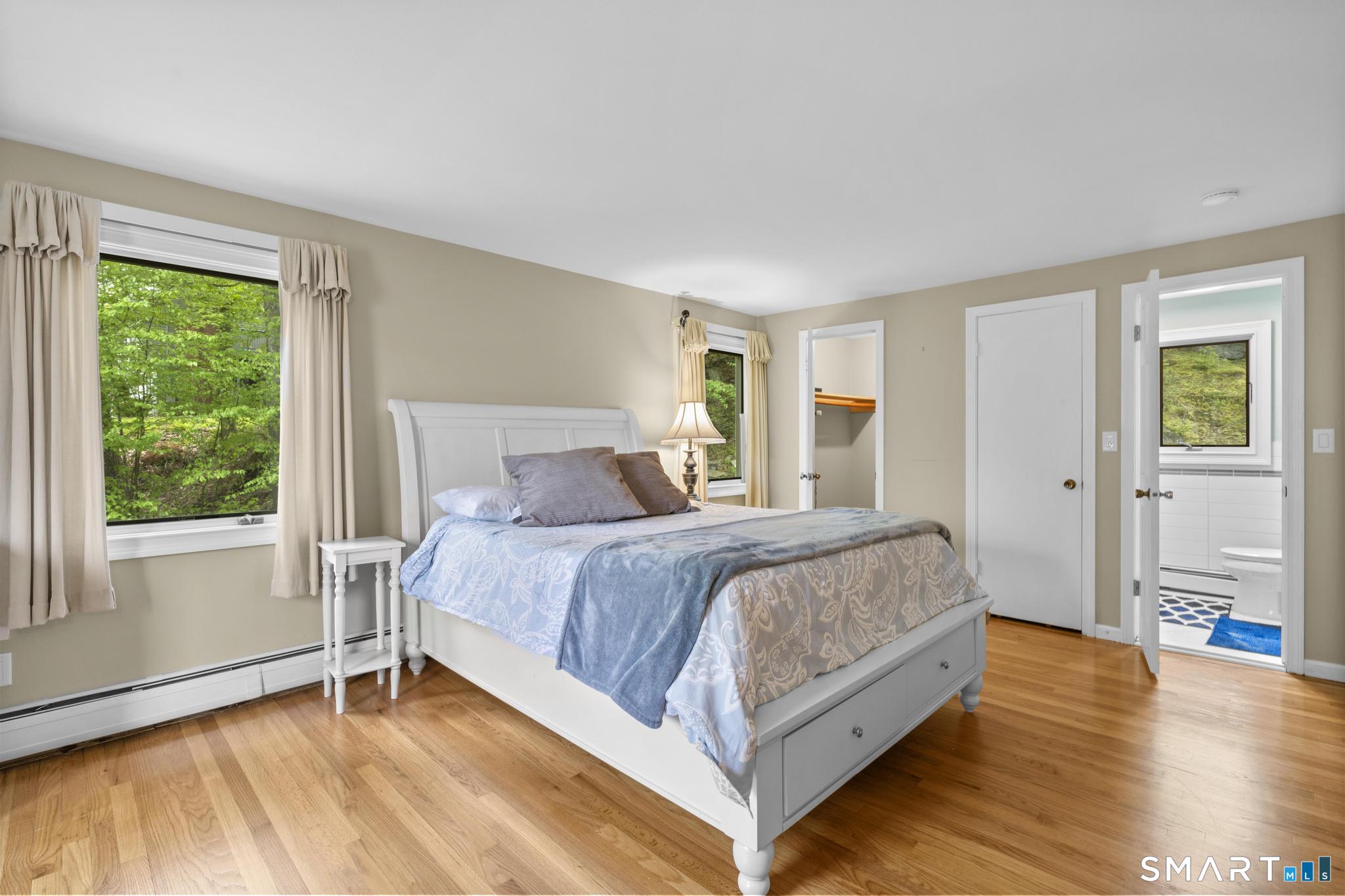 832 Quarter Mile Road Orange, CT 06477 - Photo 30 of 39 a bedroom with a bed and a window