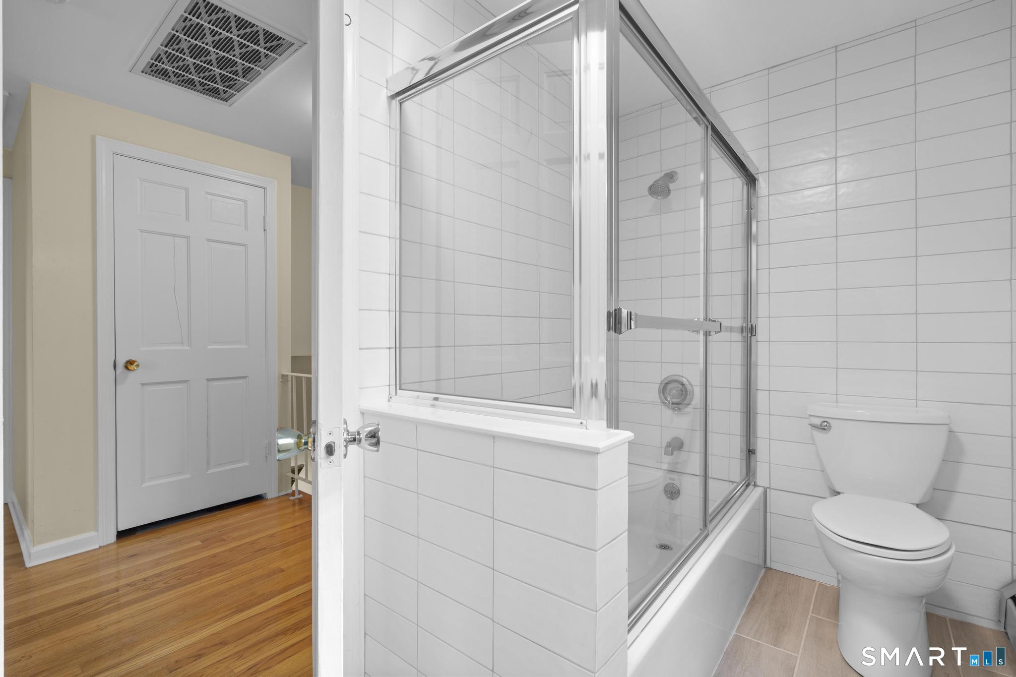 832 Quarter Mile Road Orange, CT 06477 - Photo 33 of 39 a bathroom with a toilet and a shower