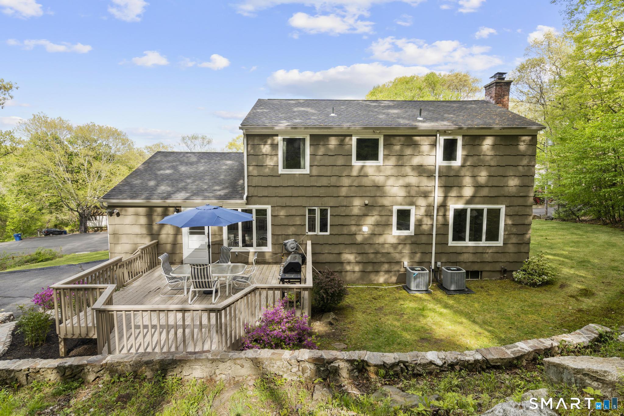 832 Quarter Mile Road Orange, CT 06477 - Photo 5 of 39 a front view of a house with garden
